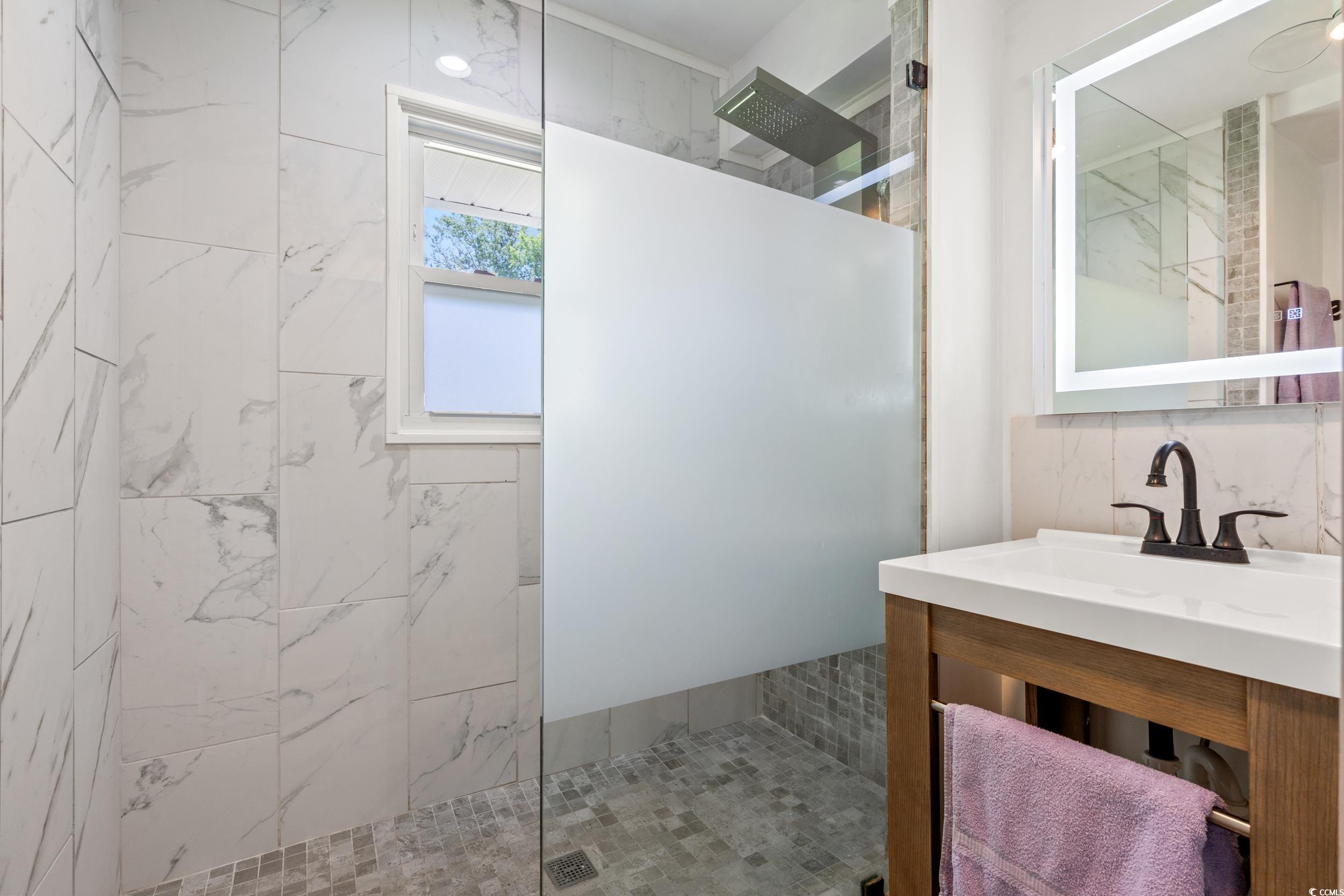 3974 North Fraser Street Georgetown, SC 29440 - Photo 15 of 36 Full bathroom with a walk in shower and vanity