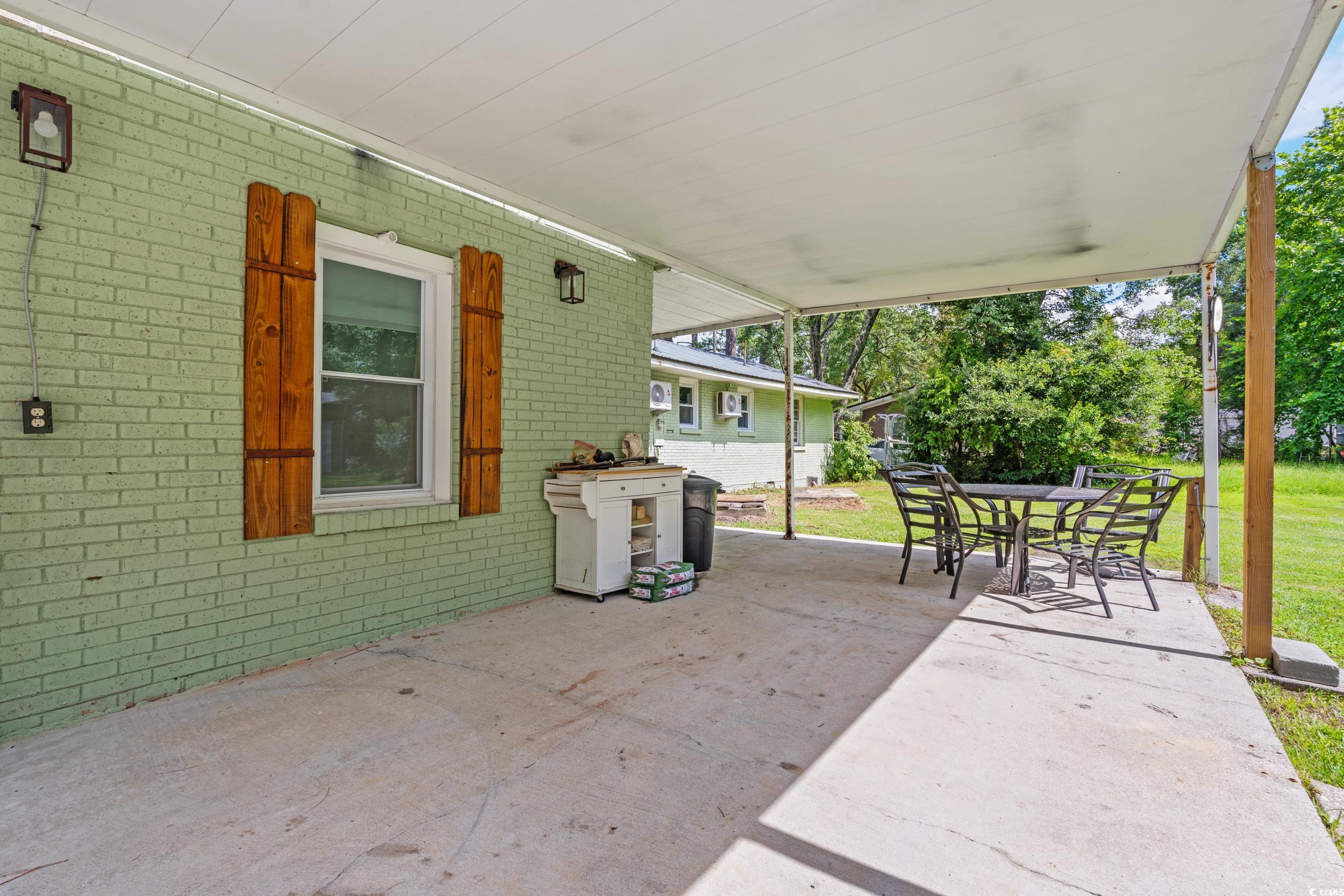3974 North Fraser Street Georgetown, SC 29440 - Photo 20 of 36 View of patio / terrace featuring outdoor dining space