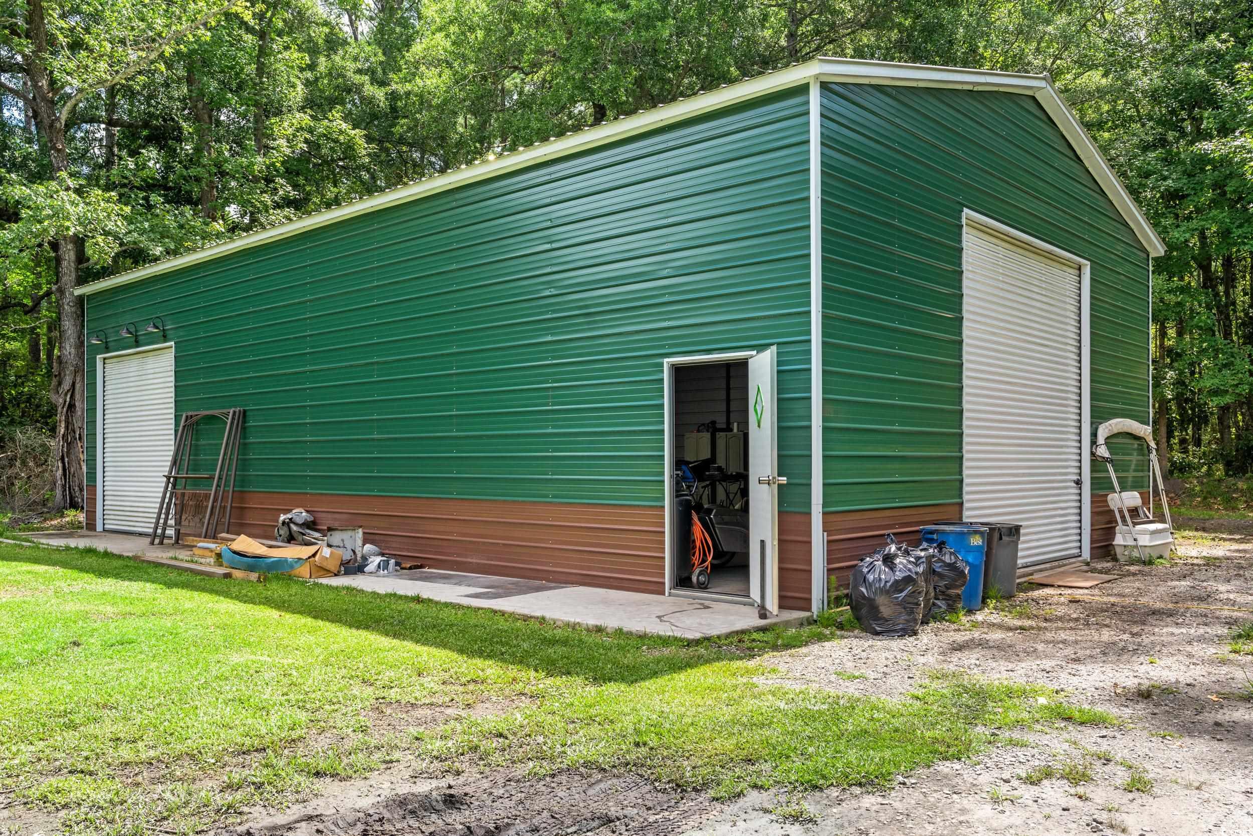 3974 North Fraser Street Georgetown, SC 29440 - Photo 6 of 36 View of side of home with an outbuilding and a yard