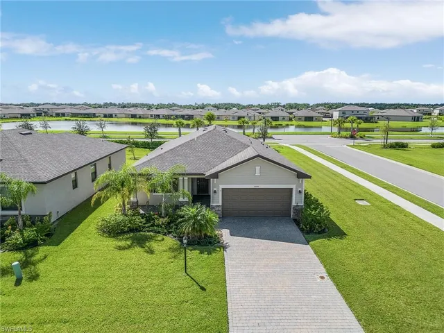 an aerial view of a house with a garden and deck