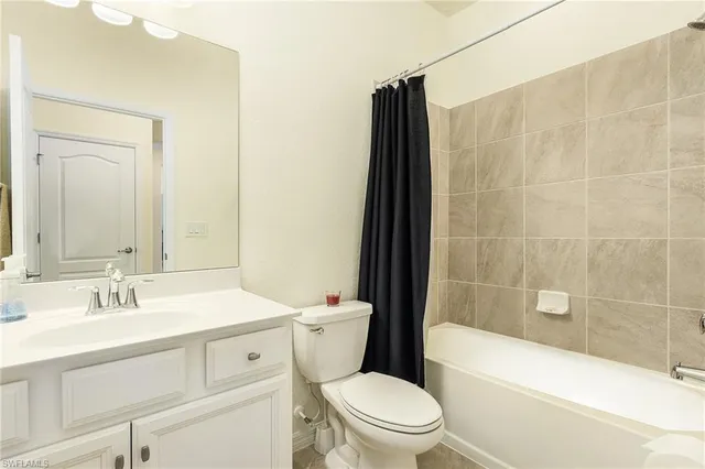 a bathroom with a sink a toilet and a bathtub