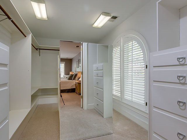 7905 Ogden Court Raleigh, NC 27613 - Photo 19 of 25 One of two, this one is custom and has amazing space and built-ins, lovely window for natural light. Master Closet