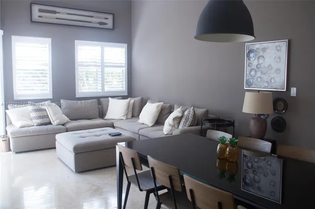 a living room with furniture and a window