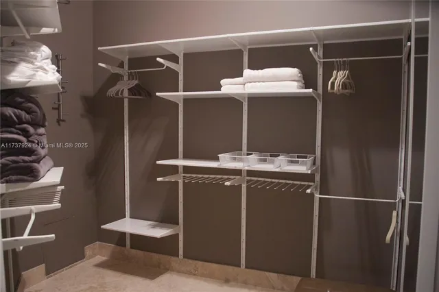 a bathroom with a shower and a sink