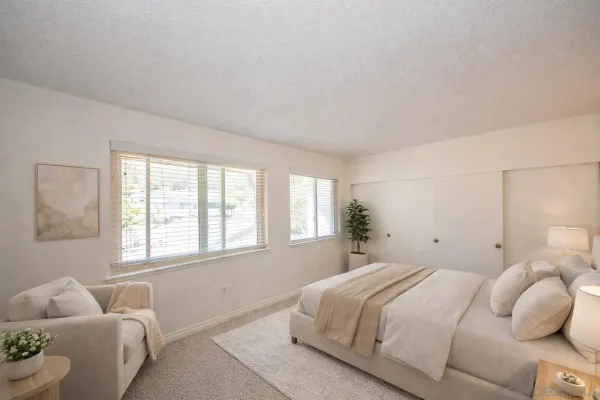 a room with gym equipment and a large window