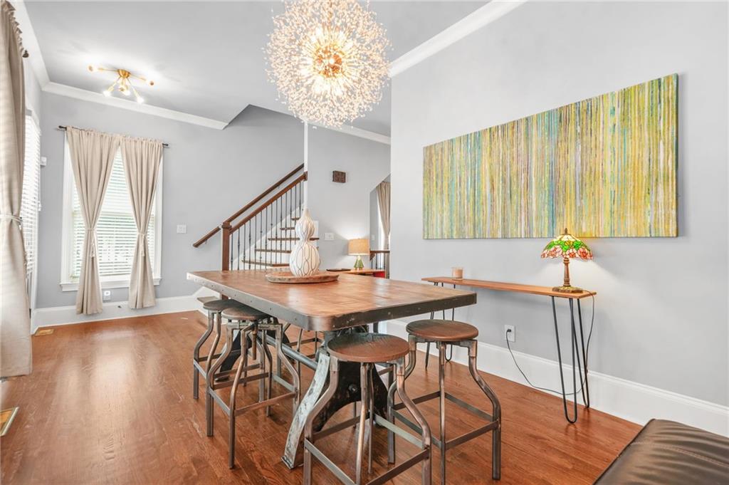 385 15th Street Northwest, Unit 6 Atlanta, GA 30363 - Photo 11 of 49 a view of a dining room with furniture and wooden floor