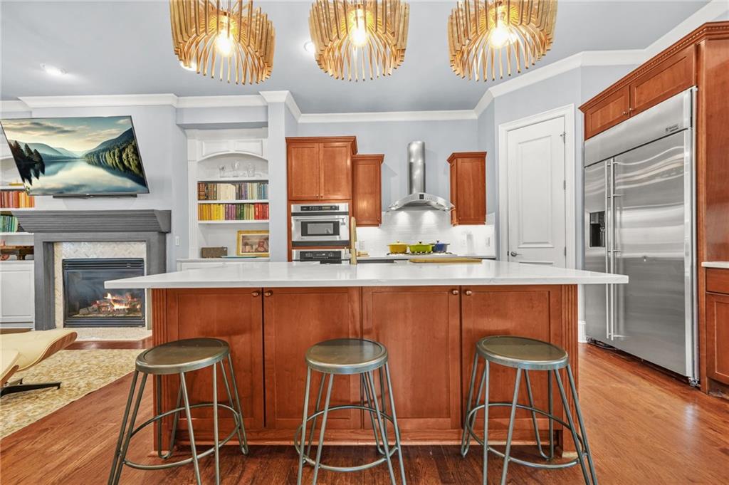385 15th Street Northwest, Unit 6 Atlanta, GA 30363 - Photo 14 of 49 a kitchen with a dining table chairs and painting on the wall