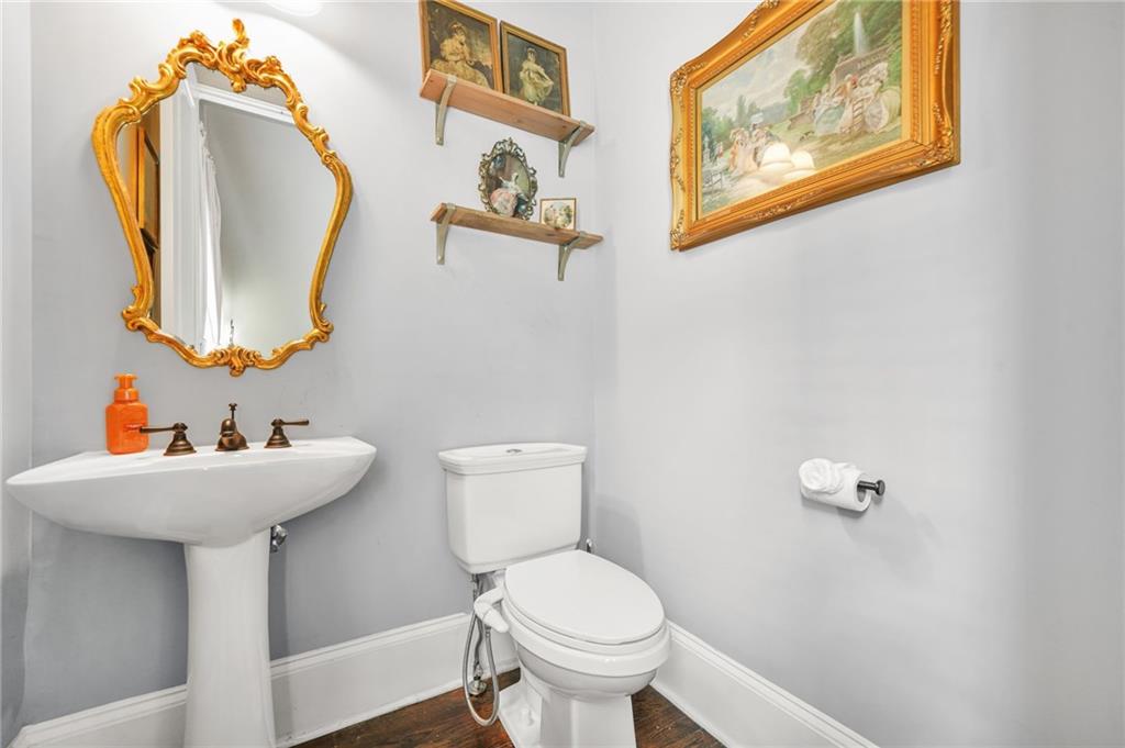 385 15th Street Northwest, Unit 6 Atlanta, GA 30363 - Photo 20 of 49 a bathroom with a toilet sink and mirror