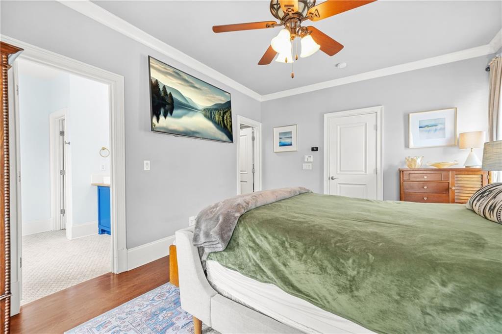 385 15th Street Northwest, Unit 6 Atlanta, GA 30363 - Photo 29 of 49 a bedroom with a bed and a chandelier