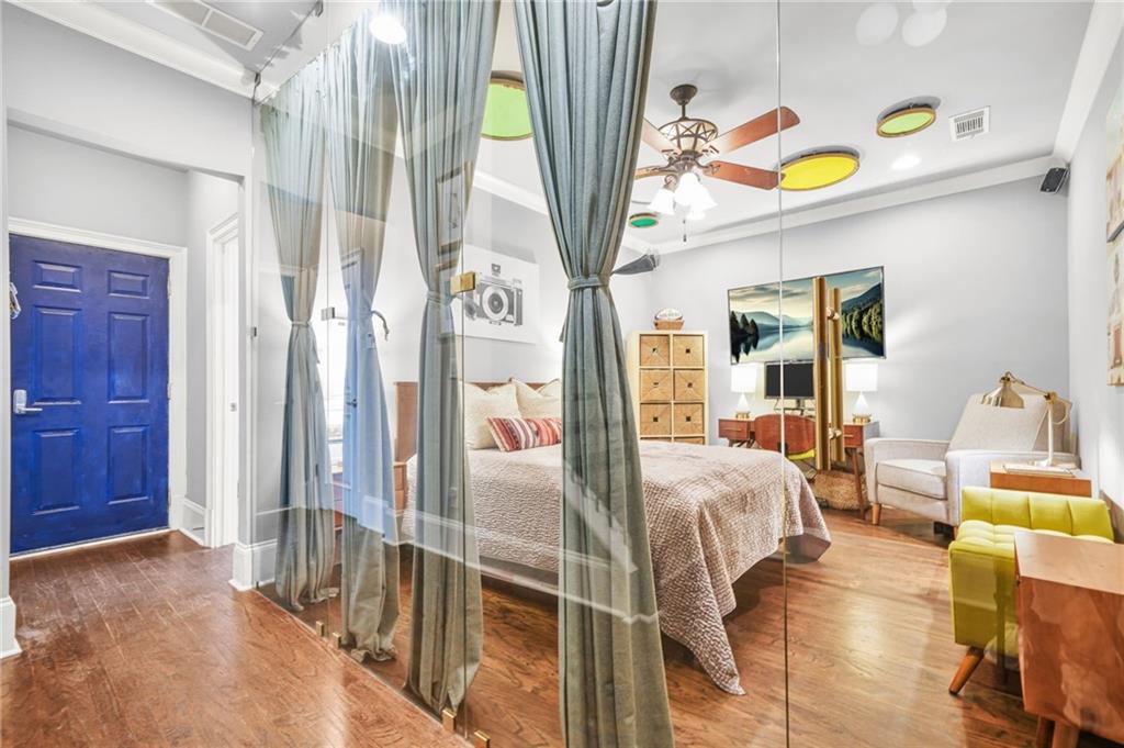 385 15th Street Northwest, Unit 6 Atlanta, GA 30363 - Photo 36 of 49 a living room with furniture and a chandelier