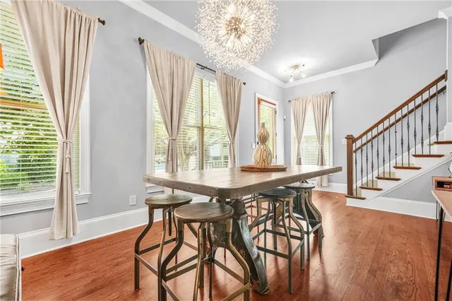 a view of a dining room with furniture window and wooden floor