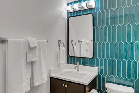 a bathroom with a sink and mirror