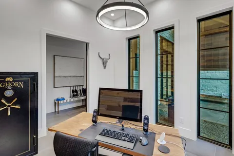 a living room with furniture a rug and a fireplace