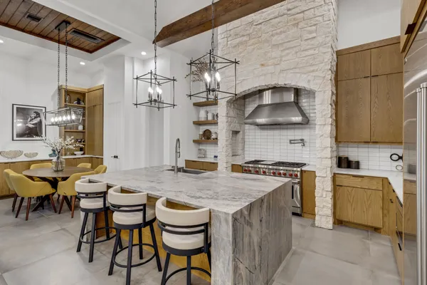 a kitchen with a stove and cabinets