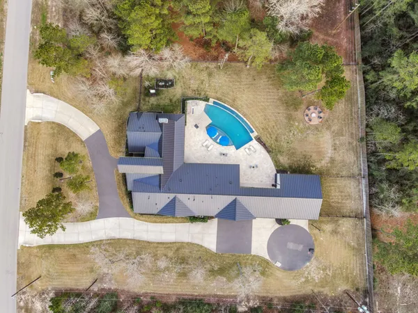 a view of a yard in front of the house with a yard