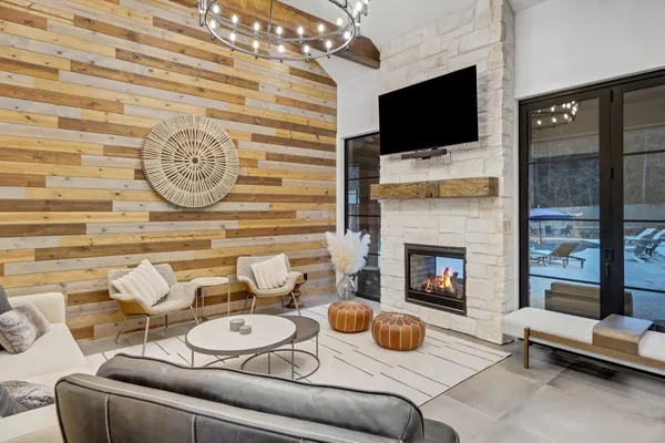 a living room with fireplace furniture and a flat screen tv