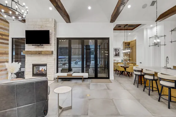 a living room with fireplace furniture and a flat screen tv