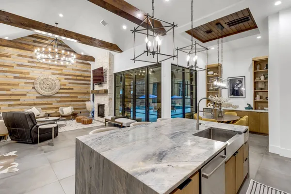 a kitchen with a table chairs and a stove