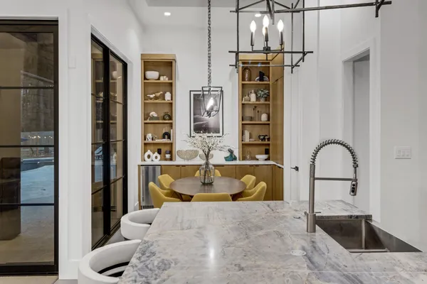 a bedroom with a bed a couch and dresser