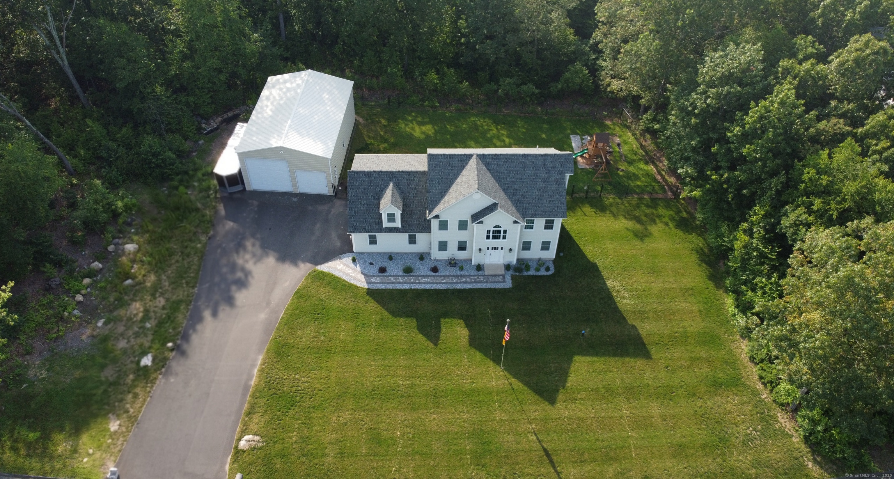 a swimming pool with outdoor seating and yard