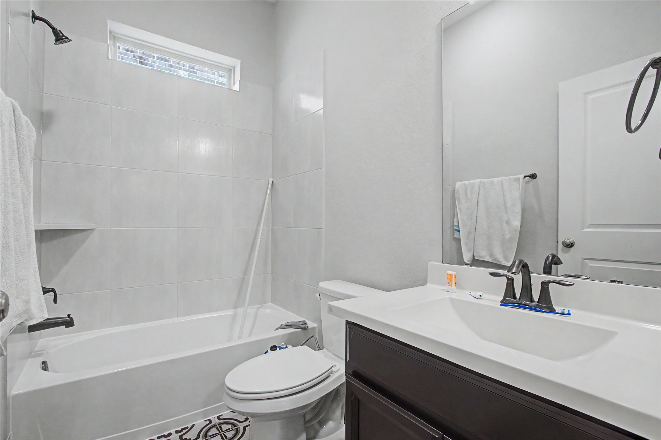 19718 Shinnery Ridge Court Cypress, TX 77433 - Photo 16 of 23 a bathroom with a sink a toilet and shower