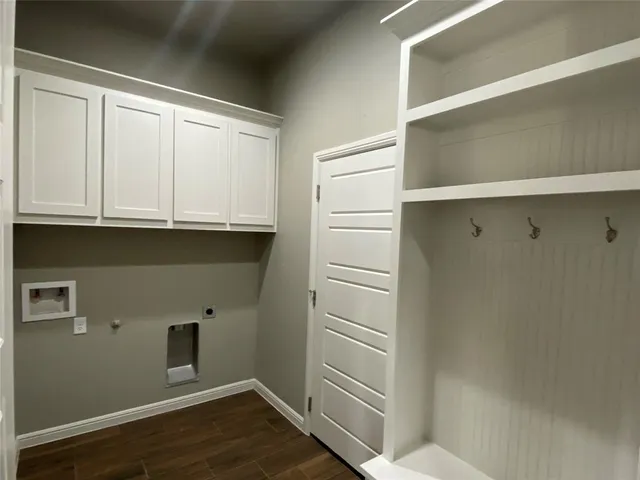 a bathroom with a sink and a white cabinet