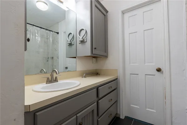 a bathroom with a sink and a mirror