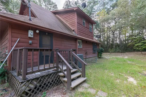 a backyard of a house with lots of green space