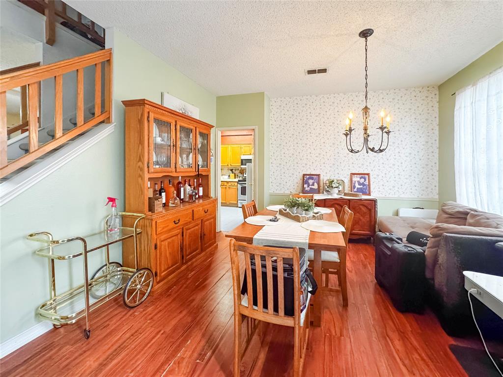 5510 Rolling Green Road Arlington, TX 76017 - Photo 7 of 19 a view of a dining room with furniture window and wooden floor