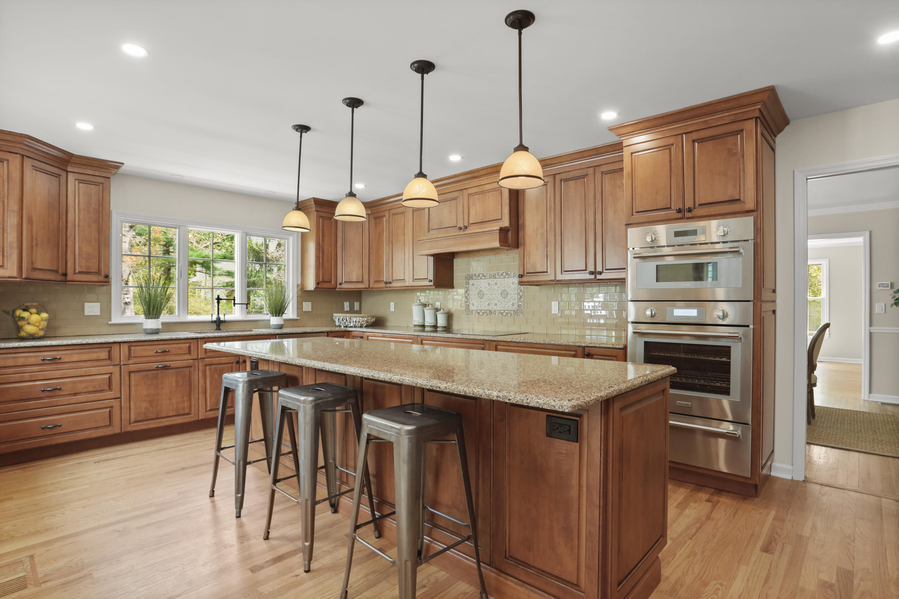 8 Ridge Farms Road Norwalk, CT 06850 - Photo 11 of 31 a kitchen with stainless steel appliances granite countertop a stove a sink dishwasher and a refrigerator with wooden floor