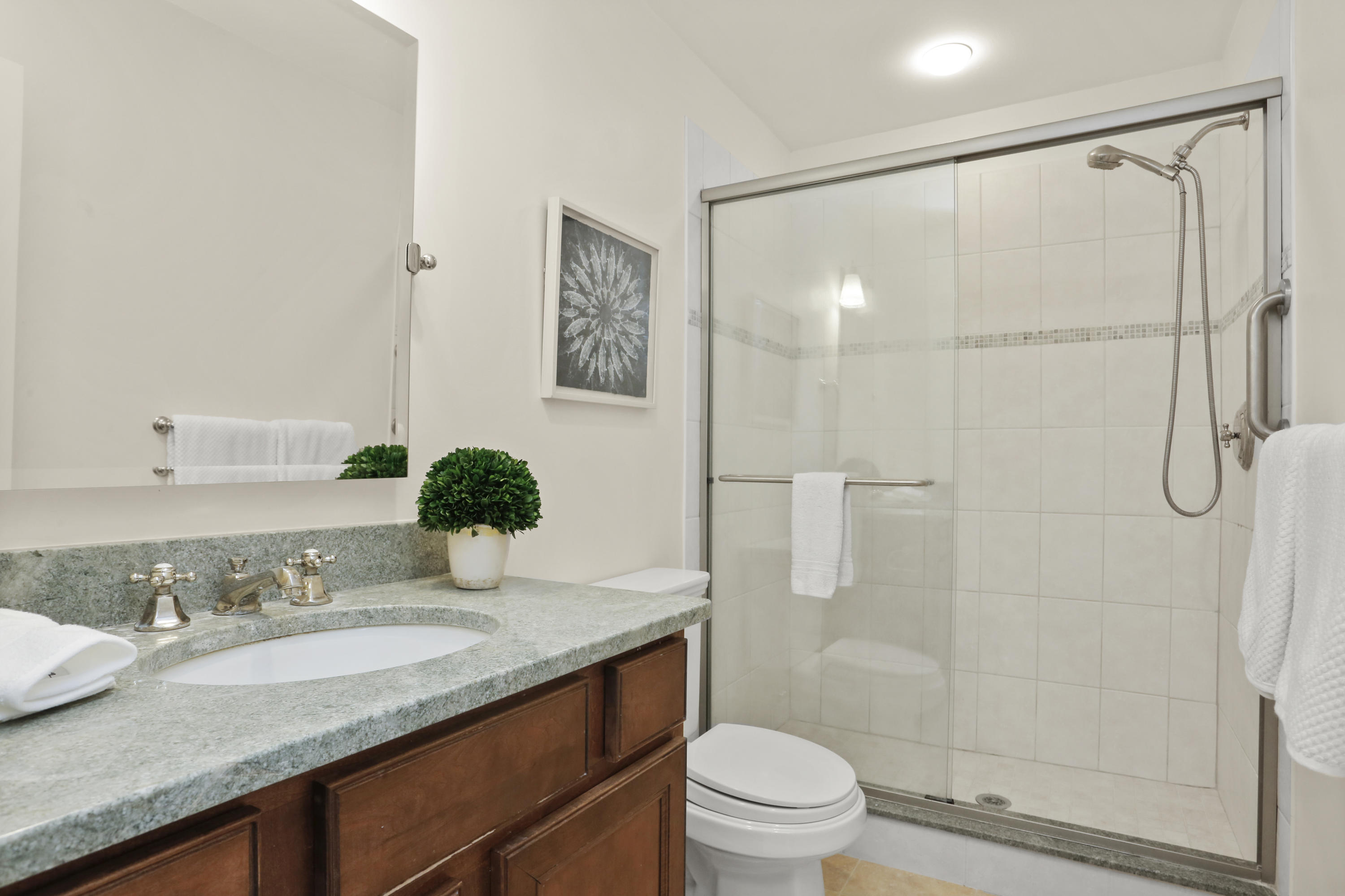 8 Ridge Farms Road Norwalk, CT 06850 - Photo 23 of 31 a bathroom with a granite countertop sink a toilet and shower