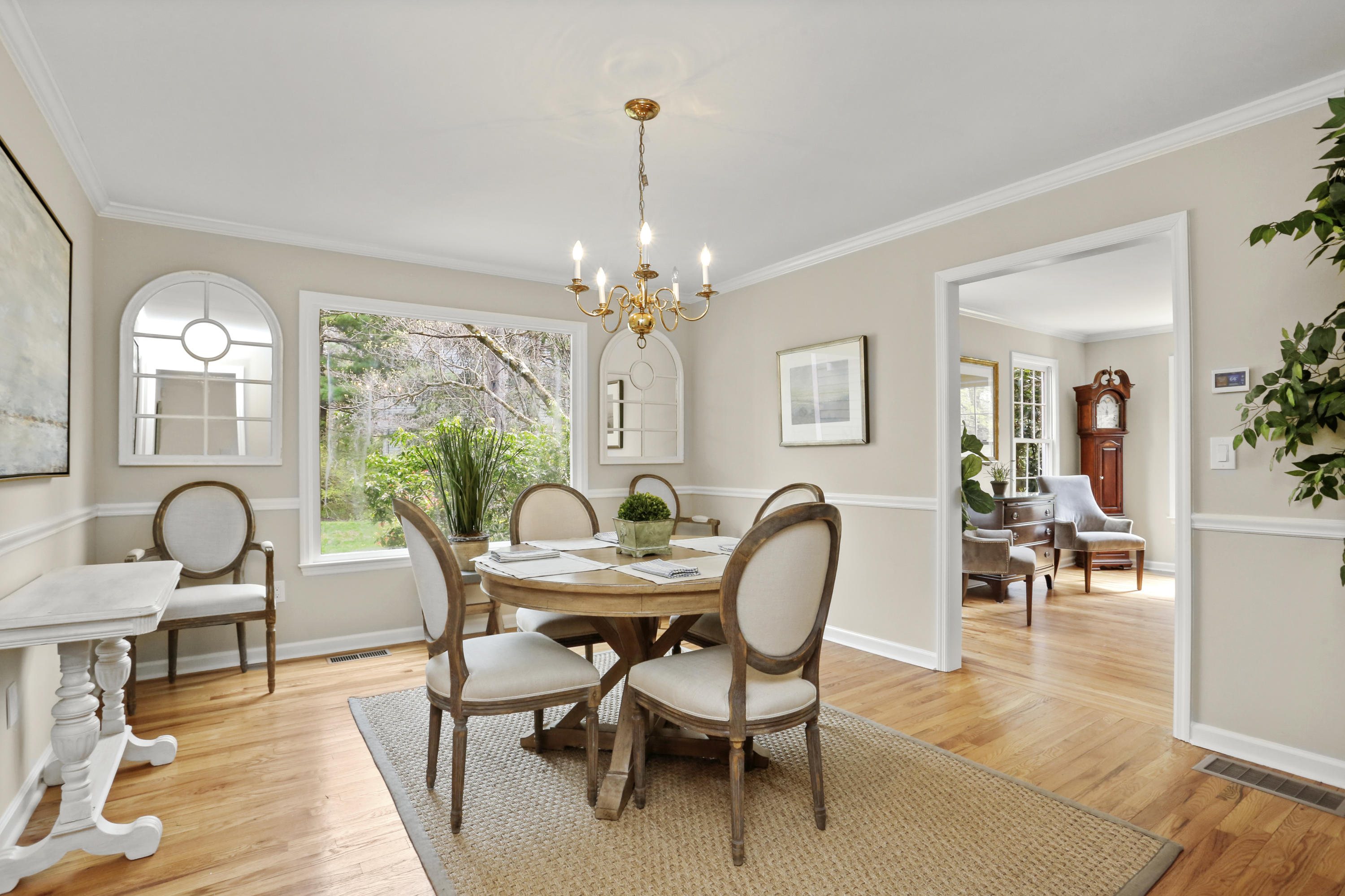 8 Ridge Farms Road Norwalk, CT 06850 - Photo 8 of 31 a dining room with furniture a chandelier and wooden floor