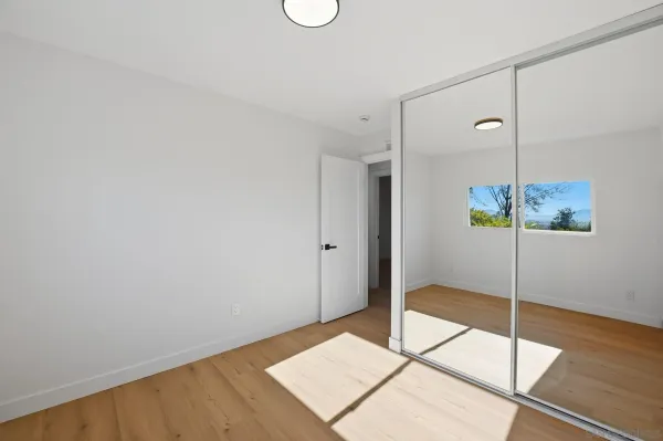 a view of a room with a table and chairs