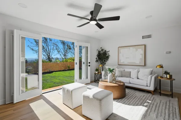 a living room with furniture and a large window