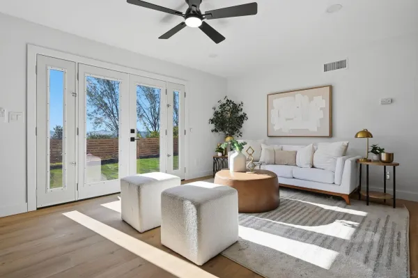 a living room with furniture and a window