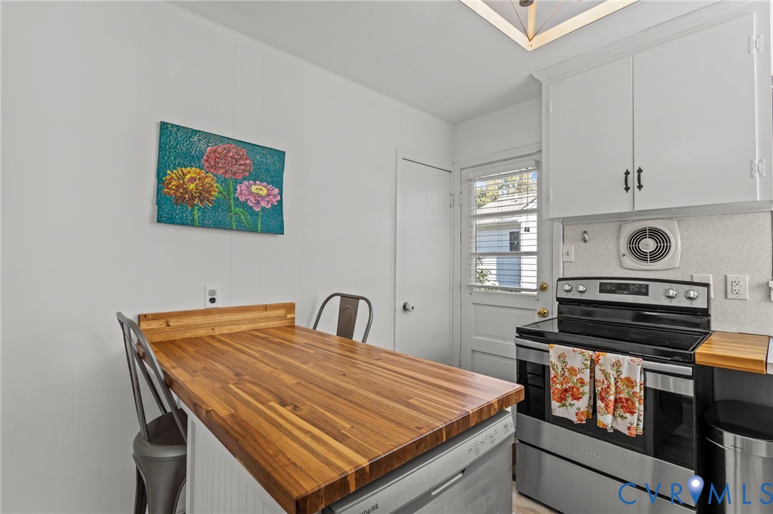 1606 Princeton Road Richmond, VA 23227 - Photo 13 of 52 a bed sitting in a kitchen next to a window