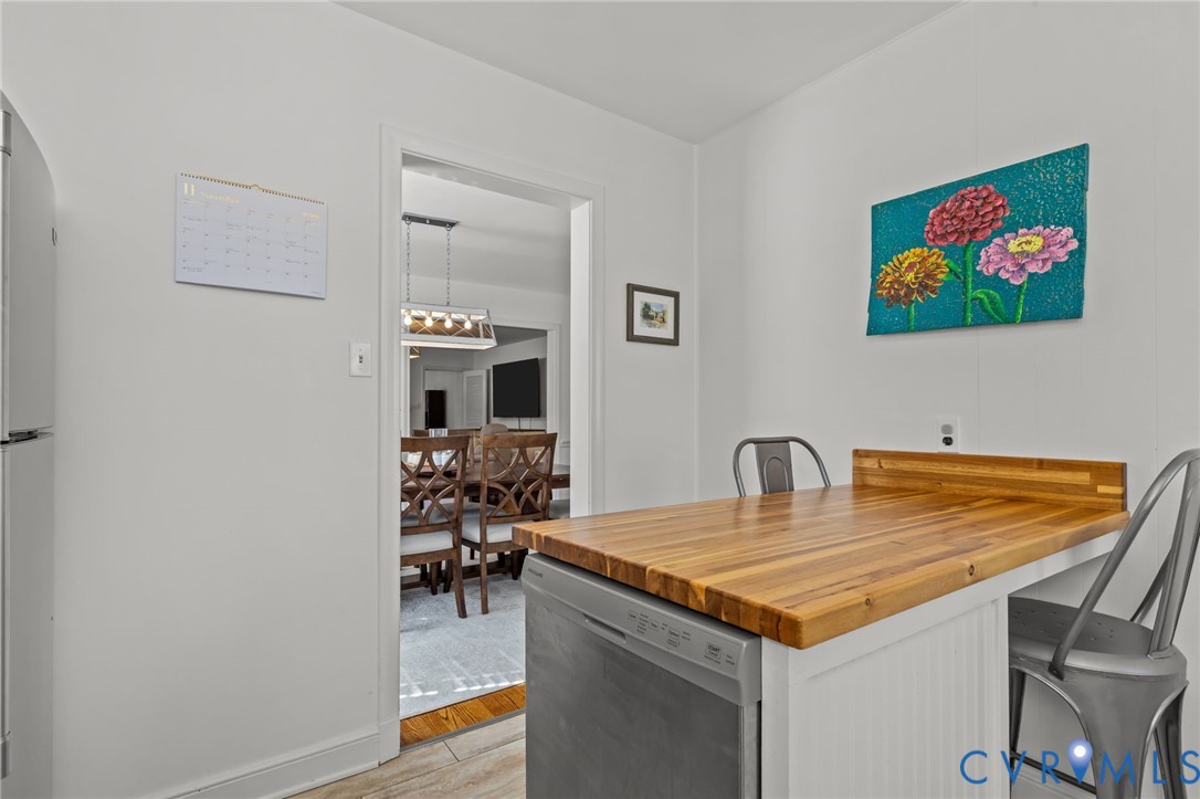 1606 Princeton Road Richmond, VA 23227 - Photo 17 of 52 a dining room with a table and chairs