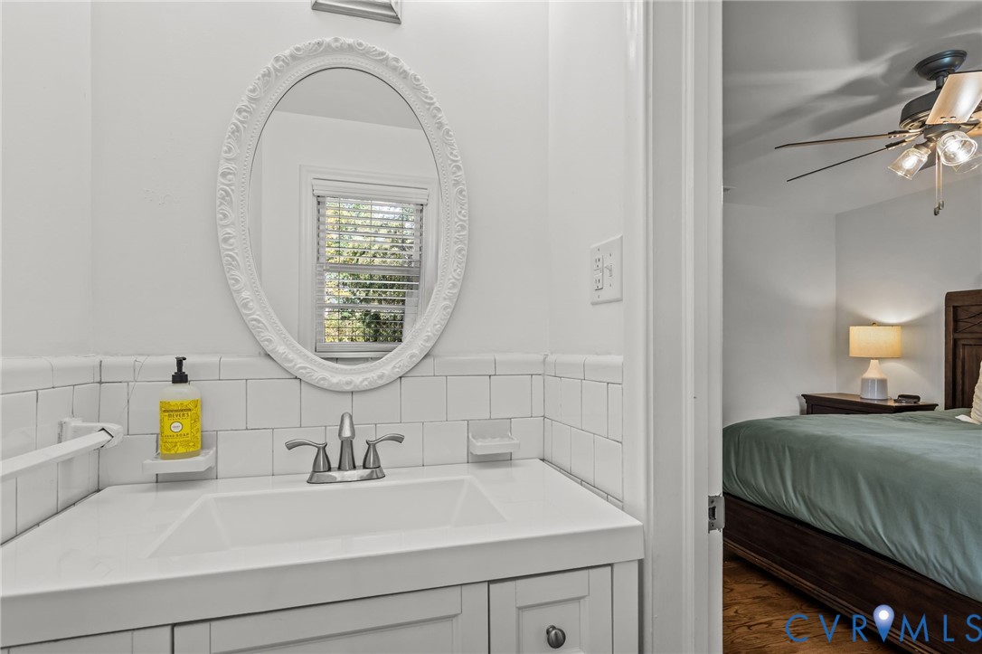 1606 Princeton Road Richmond, VA 23227 - Photo 22 of 52 a bathroom with a sink and a mirror