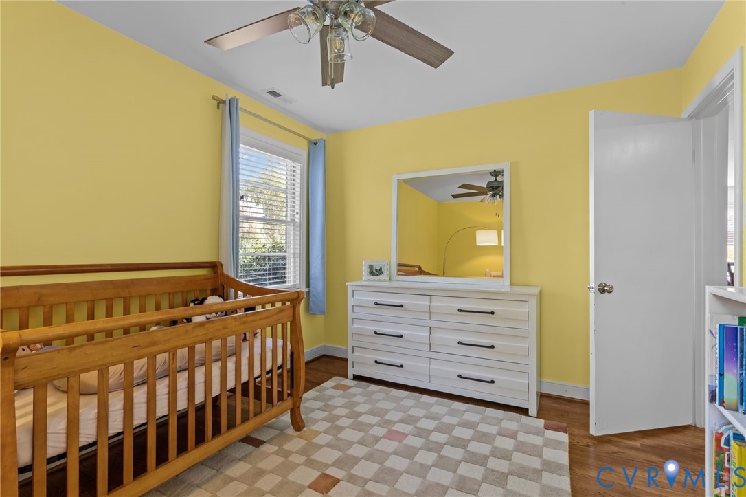 1606 Princeton Road Richmond, VA 23227 - Photo 28 of 52 a bedroom with a bed and a baby crib