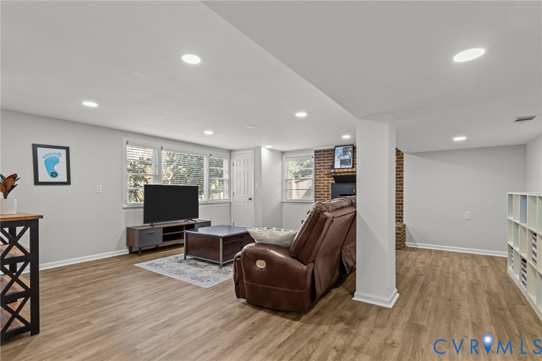 1606 Princeton Road Richmond, VA 23227 - Photo 32 of 52 a living room with furniture and a flat screen tv