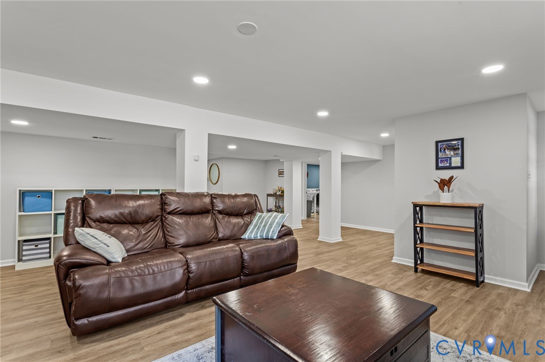 1606 Princeton Road Richmond, VA 23227 - Photo 33 of 52 a living room with furniture and wooden floor
