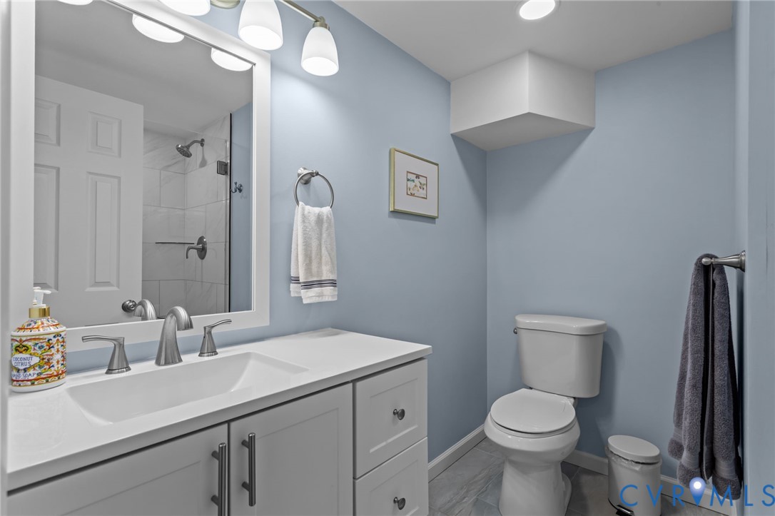 1606 Princeton Road Richmond, VA 23227 - Photo 37 of 52 a view of bathroom with a sink toilet and a mirror