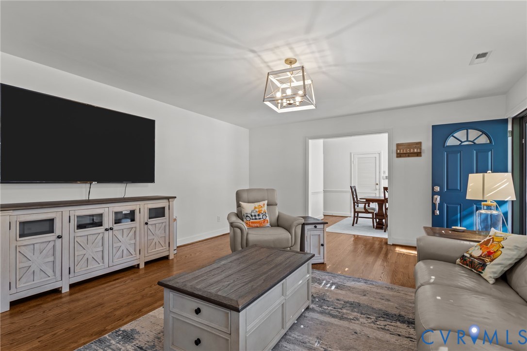 1606 Princeton Road Richmond, VA 23227 - Photo 6 of 52 a living room with furniture and a flat screen tv