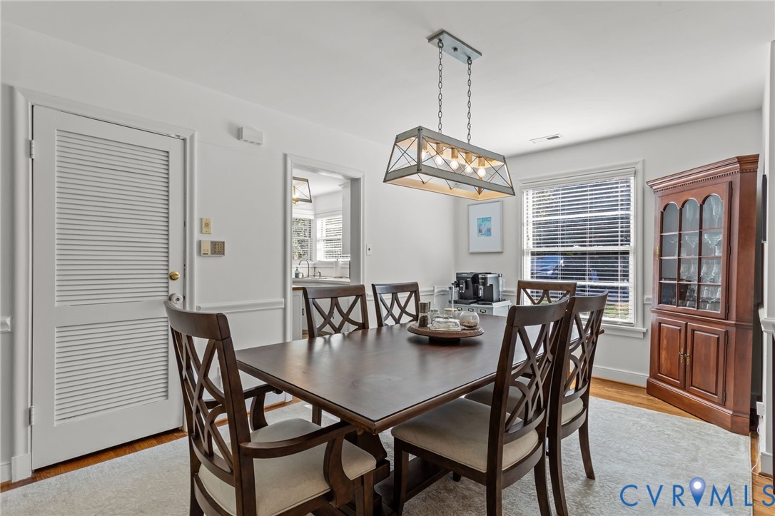 1606 Princeton Road Richmond, VA 23227 - Photo 10 of 52 a view of a dining room with furniture window and wooden floor