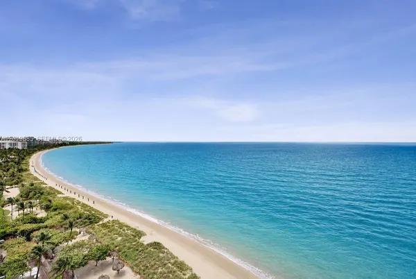 a view of a swimming pool with an ocean view