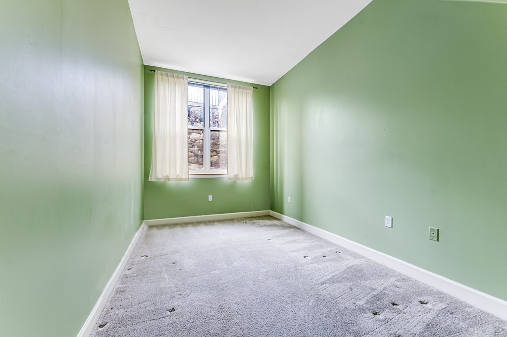 116 Milton Street, Unit 231 Dedham, MA 02026 - Photo 17 of 27 a view of an empty room with a window