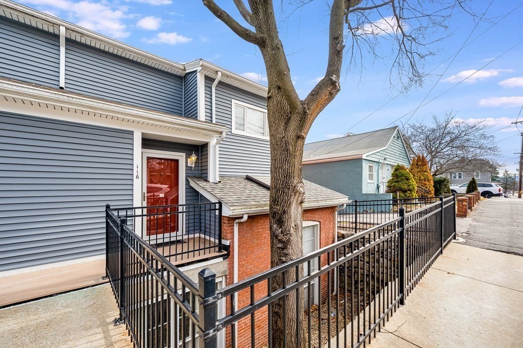116 Milton Street, Unit 231 Dedham, MA 02026 - Photo 23 of 27 a view of a house with wooden deck