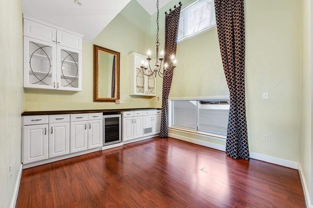 116 Milton Street, Unit 231 Dedham, MA 02026 - Photo 5 of 27 a spacious bathroom with a double vanity sink and a mirror