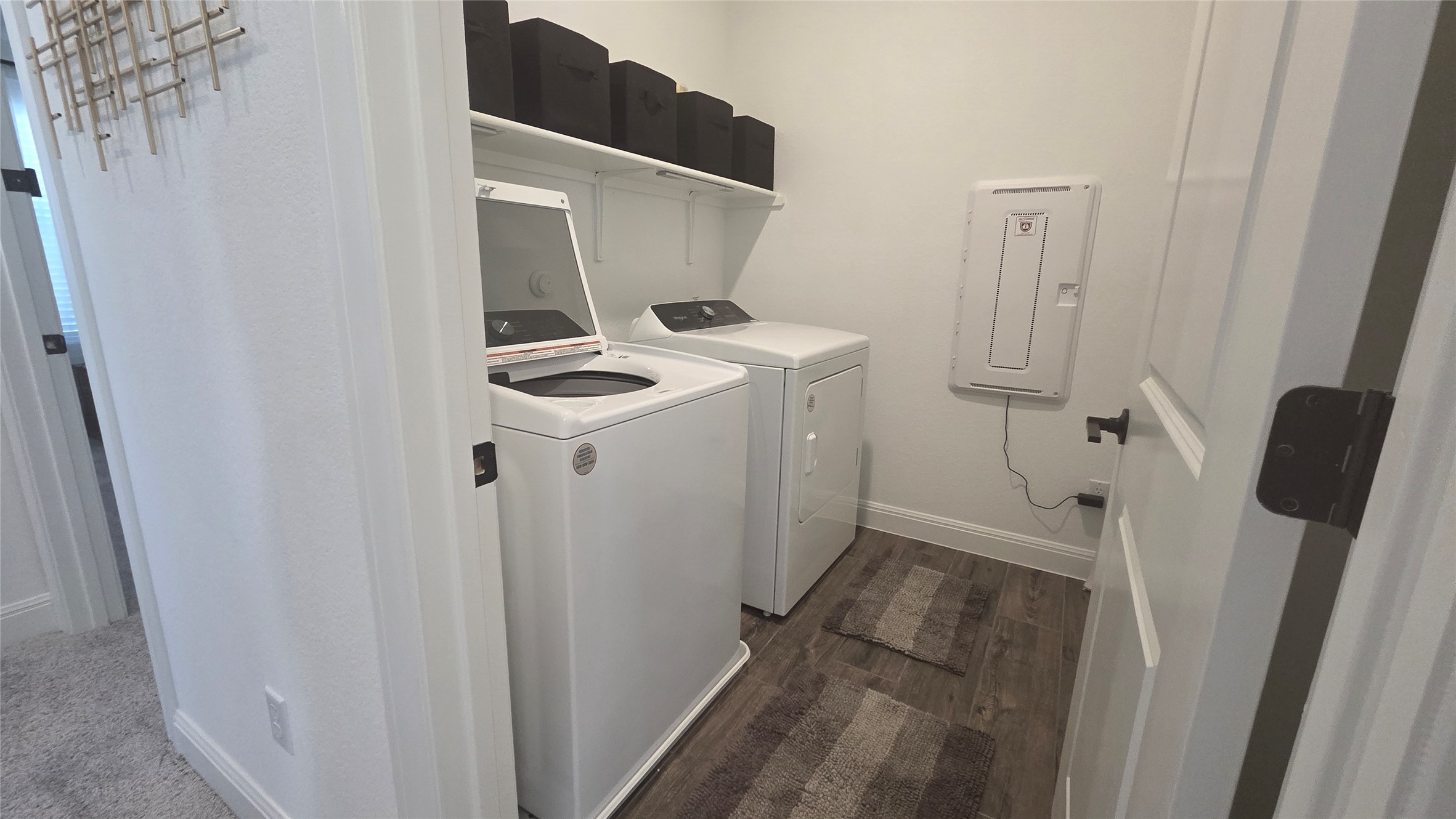 125 Raleigh Drive Georgetown, TX 78633 - Photo 22 of 30 Laundry area with dark wood finished floors and washer and dryer