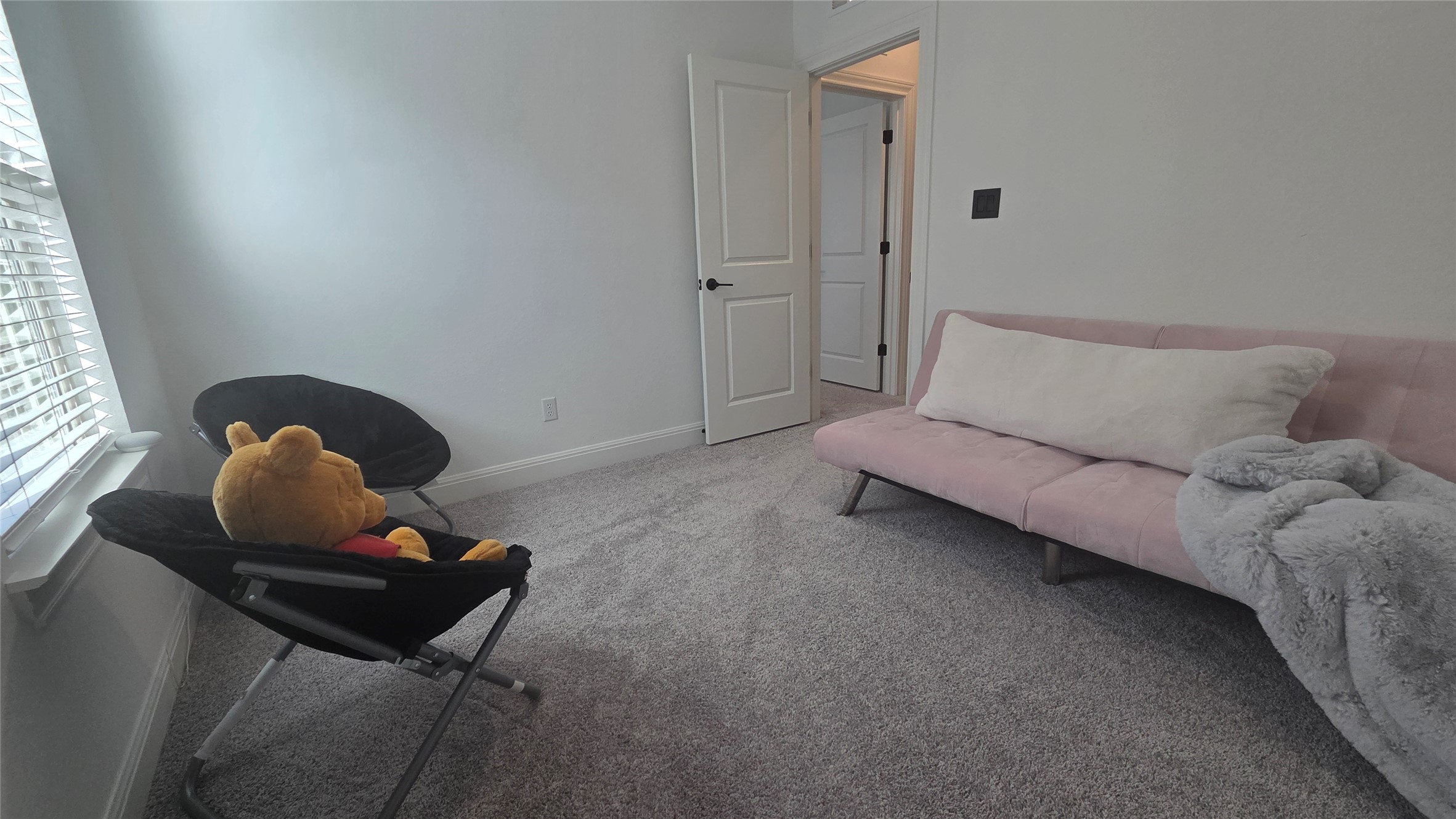 125 Raleigh Drive Georgetown, TX 78633 - Photo 24 of 30 Living area featuring light carpet and baseboards